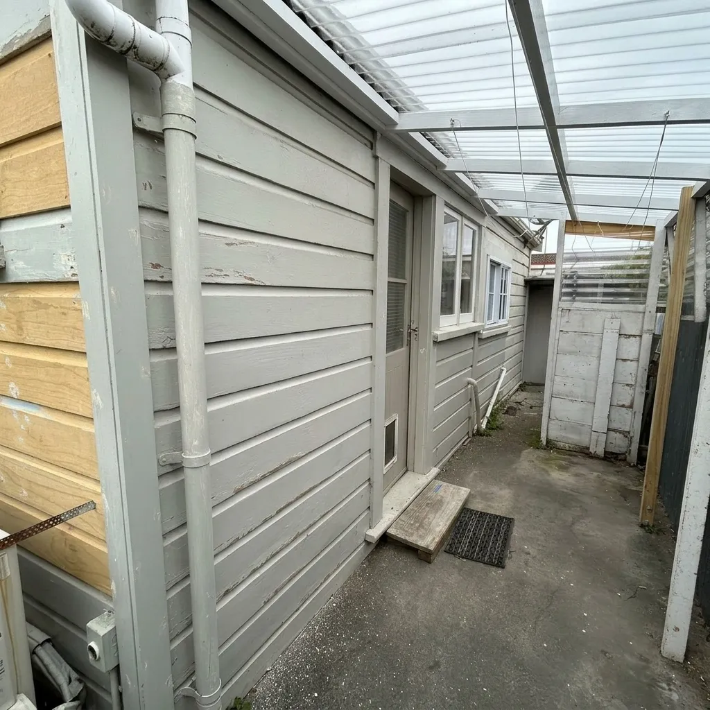 Exterior side cladding before repainting
