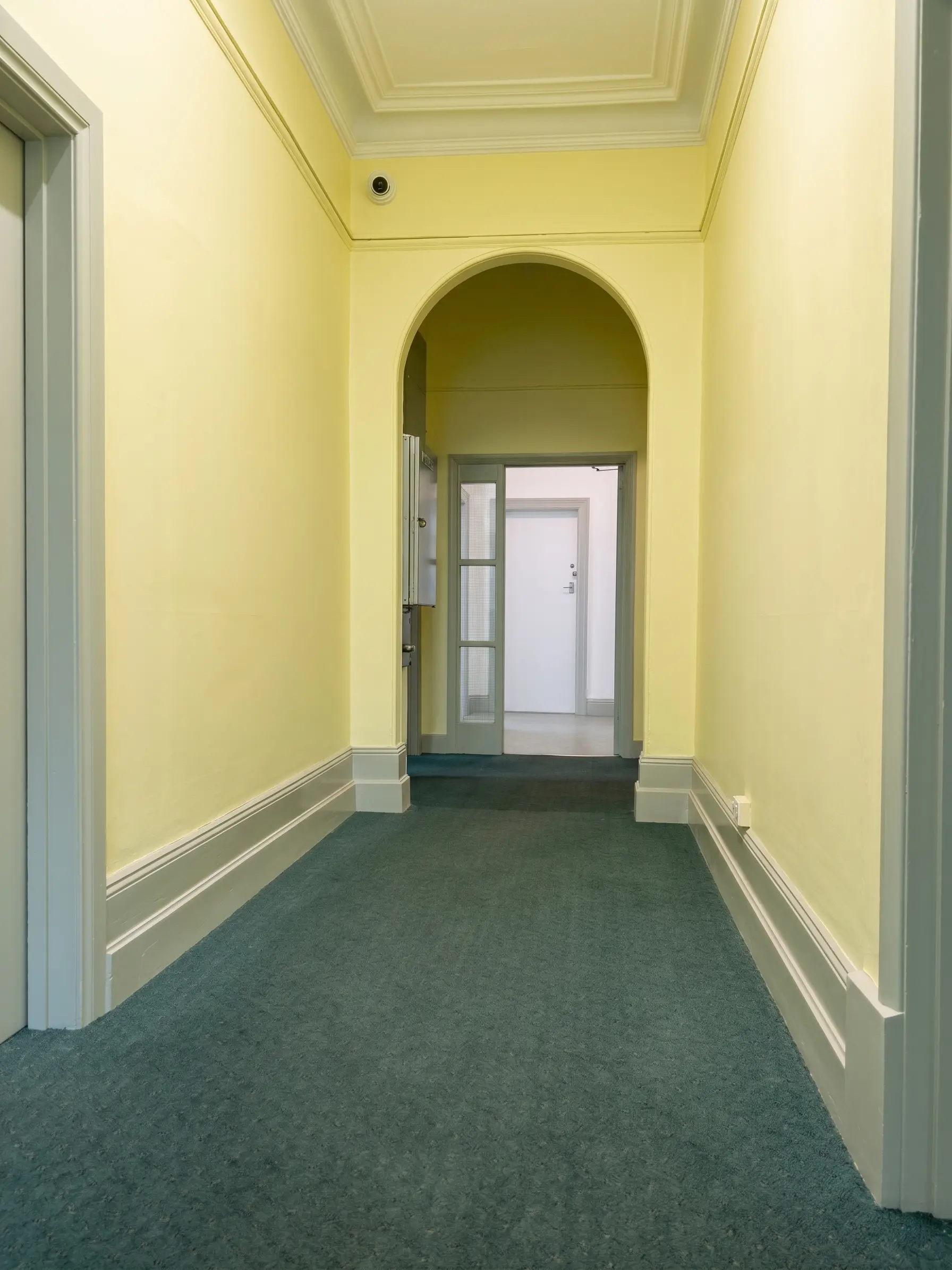 Finished hallway painting with period detailing and clean trim lines